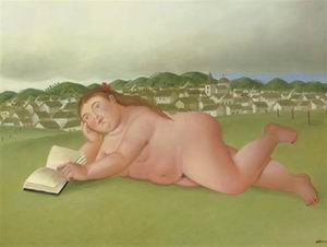 Nude reading on the grass