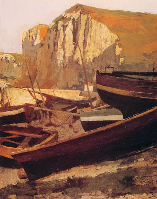 Boats at the foot of a cliff in Normandy