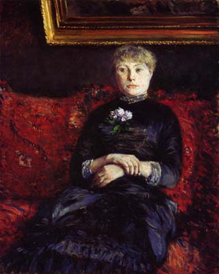 Woman Sitting on a Red-Flowered Sofa