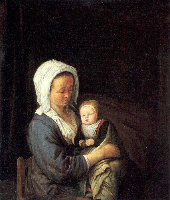 Woman Holding A Child In Her Lap