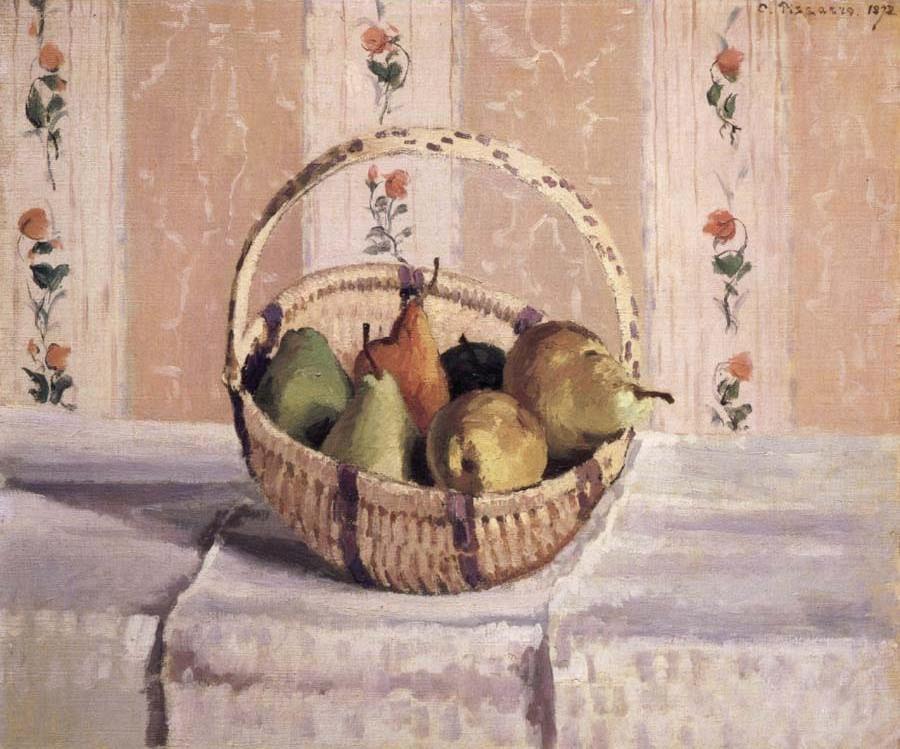 apples and pears in a round basket