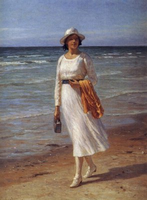A Lady Walking On A Beach